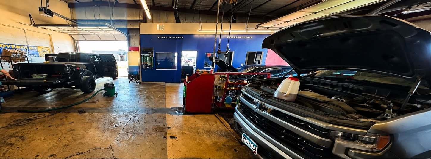 Buffalo Quick Lube shop bays with vehicles being serviced
